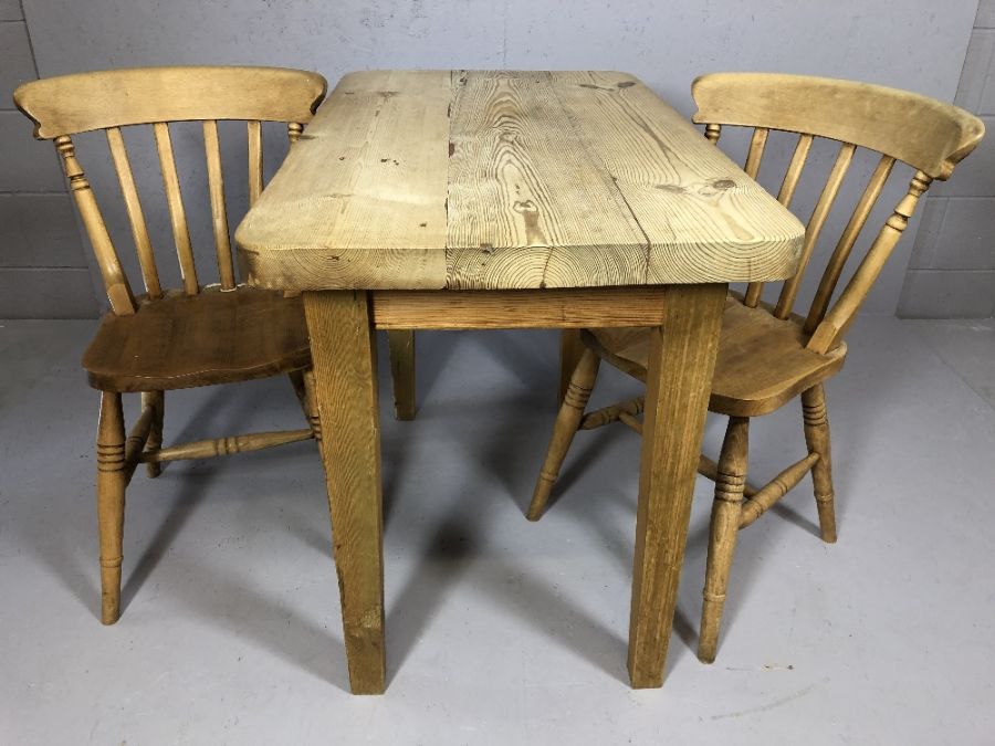 Small pine table and two pine chairs, table approx 1060x 62 x 8o cm tall