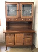 Cherrywood kitchen dresser / baker's cabinet, base with drawers and cupboard on castors, two