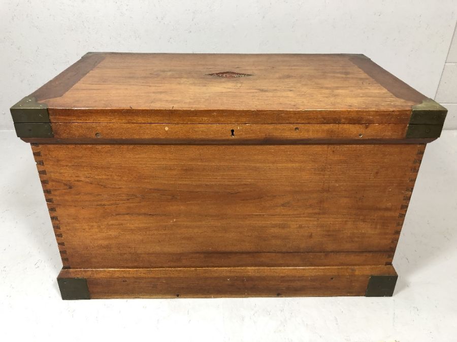 Campaign style chest with brass hinges and corners and inlaid brass metal plaque which reads 'A.C.