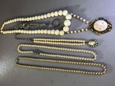 Collection of Jewellery to include beaded necklace with gold coloured framed bone cameo brooch and