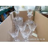 2 cut glass decanters together with 4 dia cut wine glasses