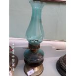 Paraffin lamp with light blue glass flue on circular plated base