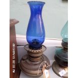 Brass paraffin lamp with cobalt blue glass shade