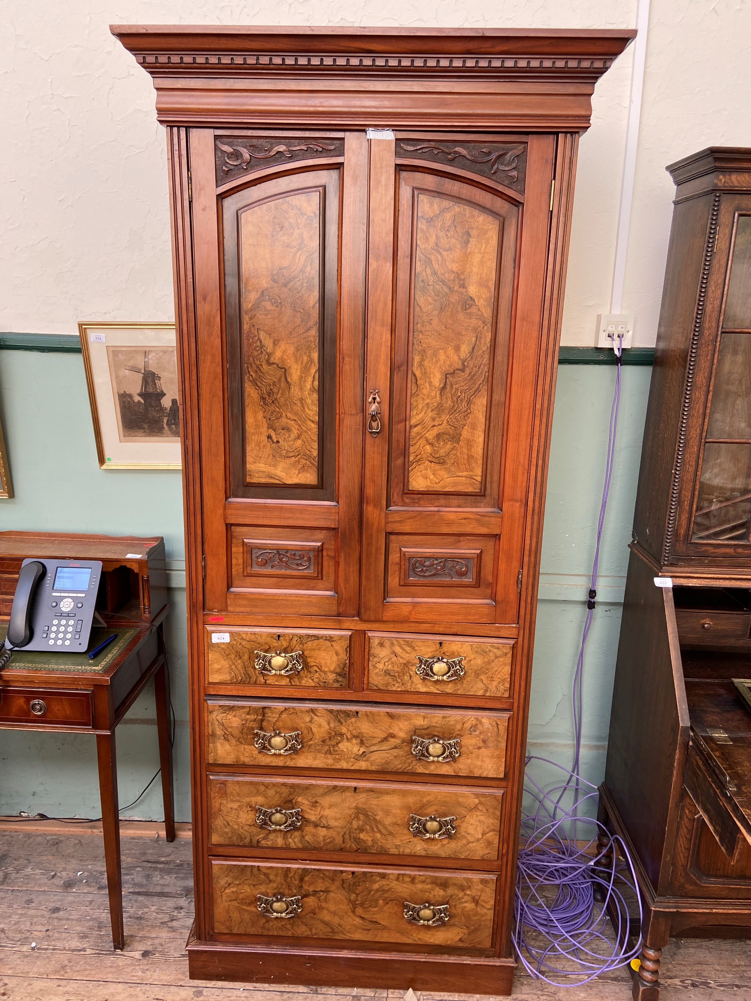 Cabinet chest in mixed woods, the upper portion fitted 2 storage shelves,