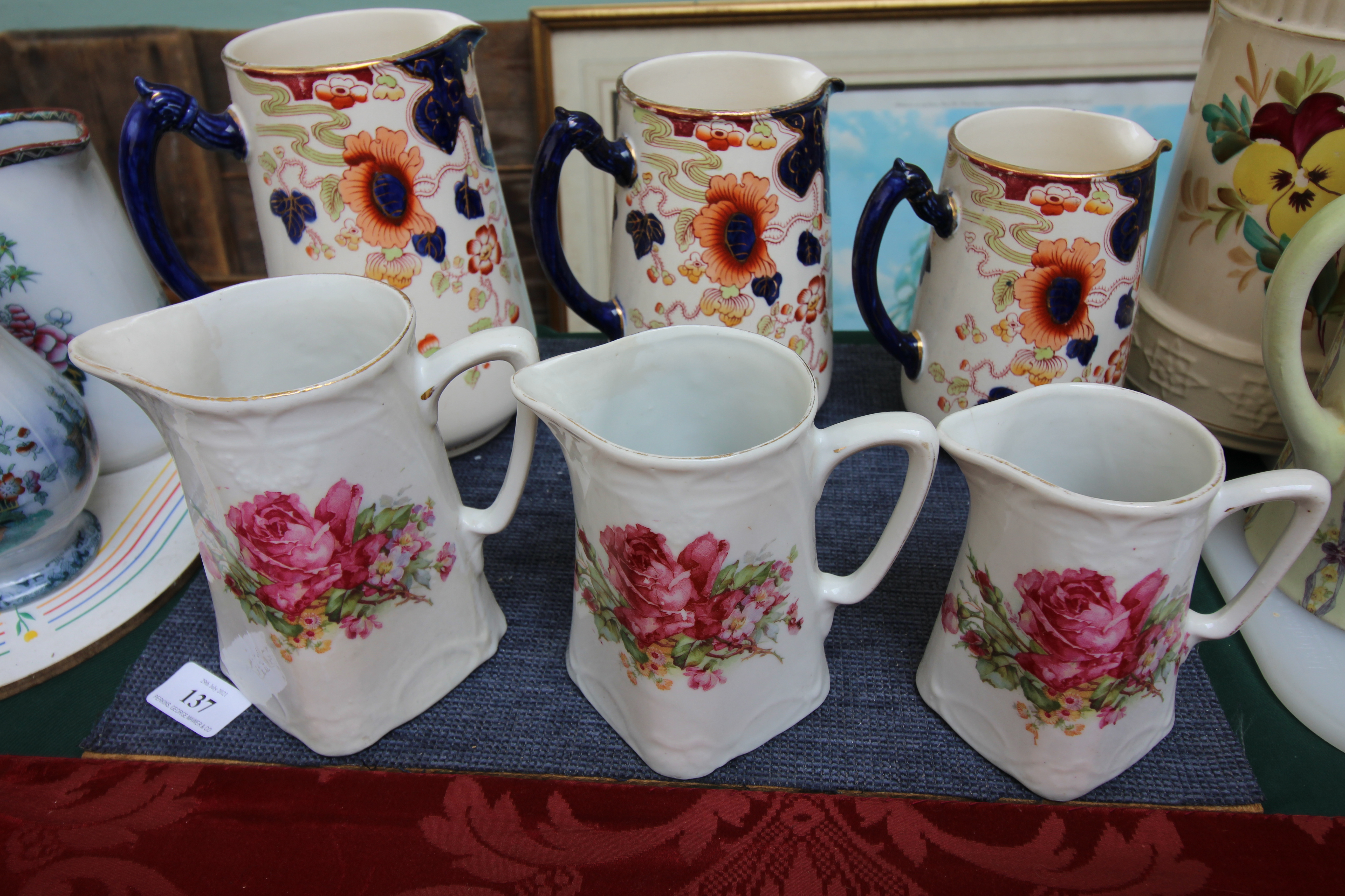 Set of three Keeling & Co ' Tokyo' water jugs decorated multi coloured floral sprays and three