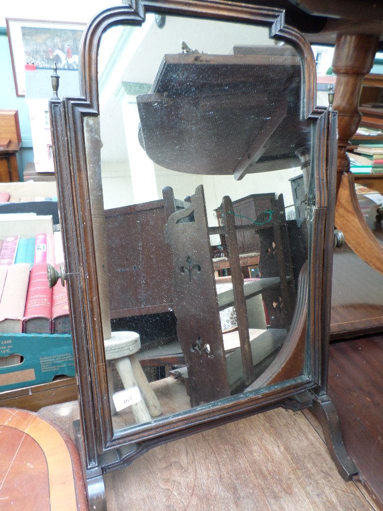 Adjustable mahogany framed toilet mirror