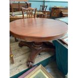 Circular topped dining table on 3 splayed claw feet offered with 3 spare leaves