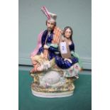 Large Staffordshire Victorian flatback 'clock' figure of a Scotsman and his lady companion