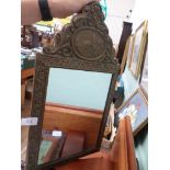 Ornate brass framed Art Deco bevel edged wall mirror