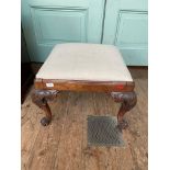 Victorian mahogany foot stool on ornate claw feet,