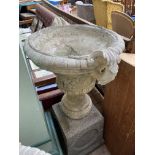 Larger urn shaped stone planter on square base