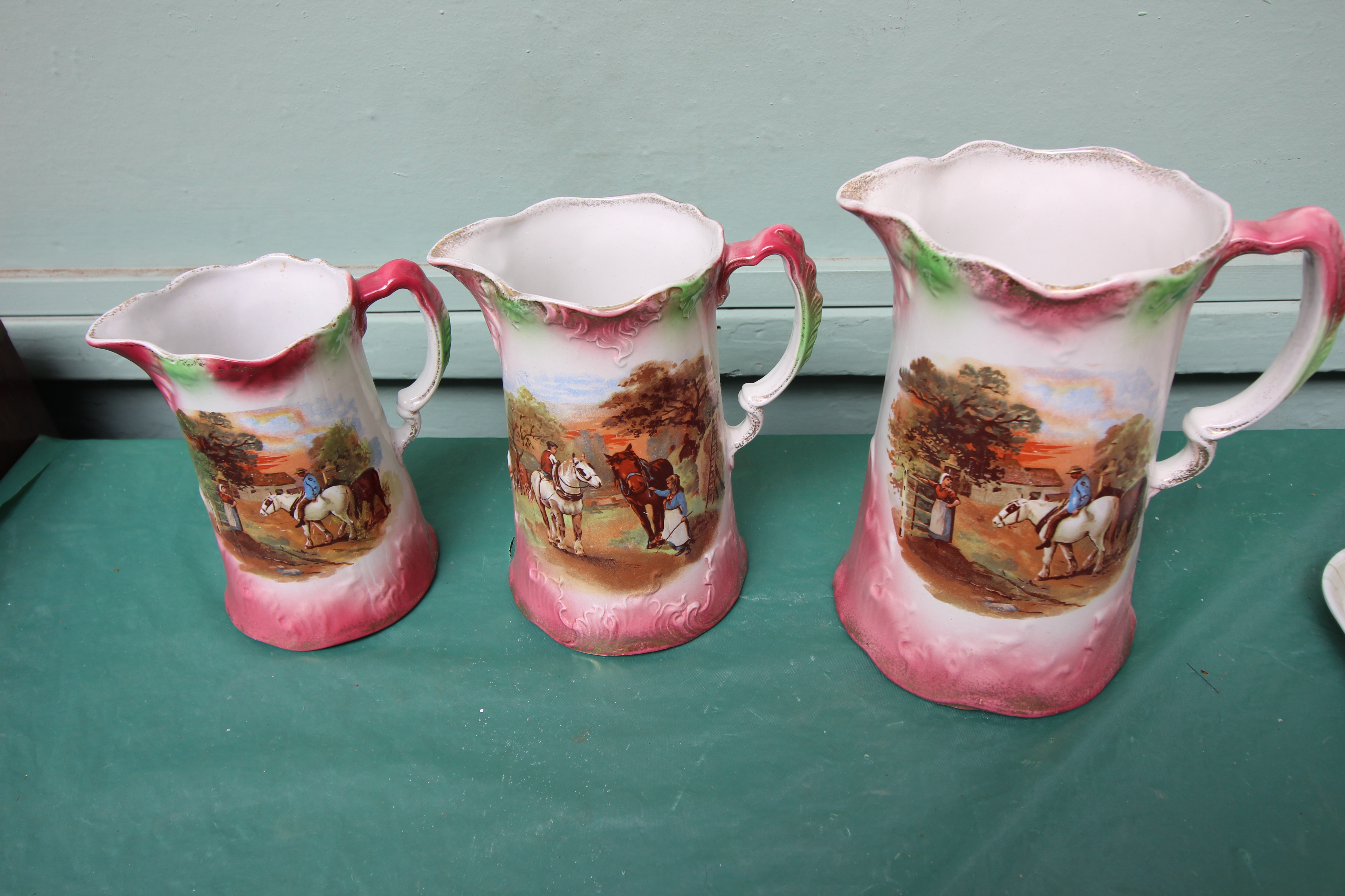 Set of three graduated jugs decorated richly multi coloured sprays and a further set of three - Image 3 of 3