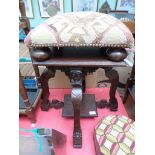 Most ornate table seat on 4 carved splayed feet with undershelf together with a studded padded