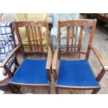Pair of oak framed armchairs each with 4 plain vertical sticks to back,