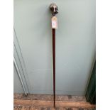 Ebony walking cane with plated handle in the form of Goliath carrying a globe