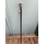 Ebony late Victorian walking cane with silver handle and collar