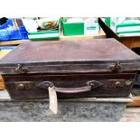 Brown leather case of damask embroidered and crotched table linen etc