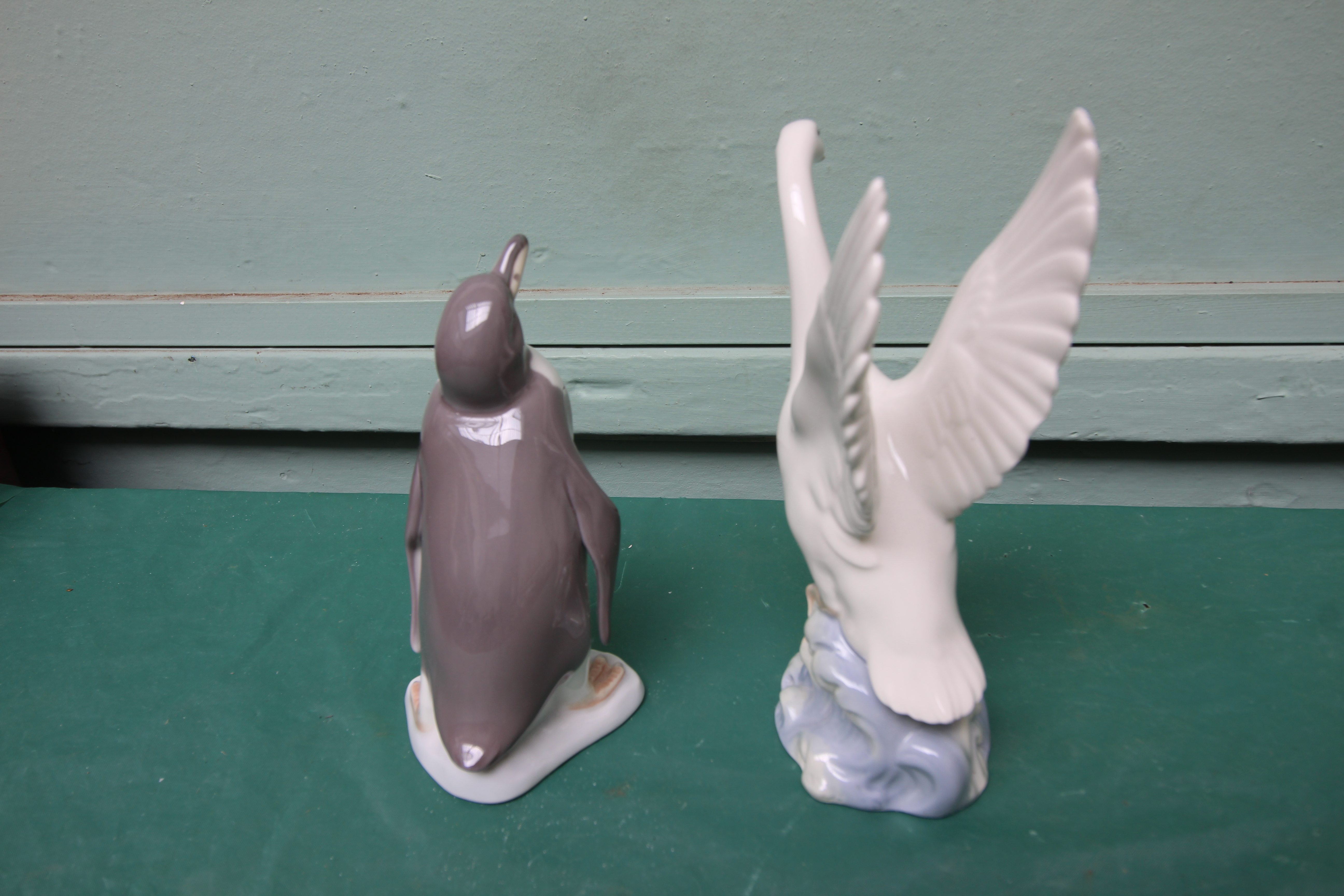 Lladro figure of a penguin and a Nao figure of an alighting swan - Image 2 of 2