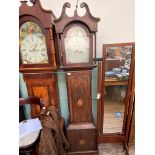 Long cased clock in mixed woods with swan neck pediment and brass finial,