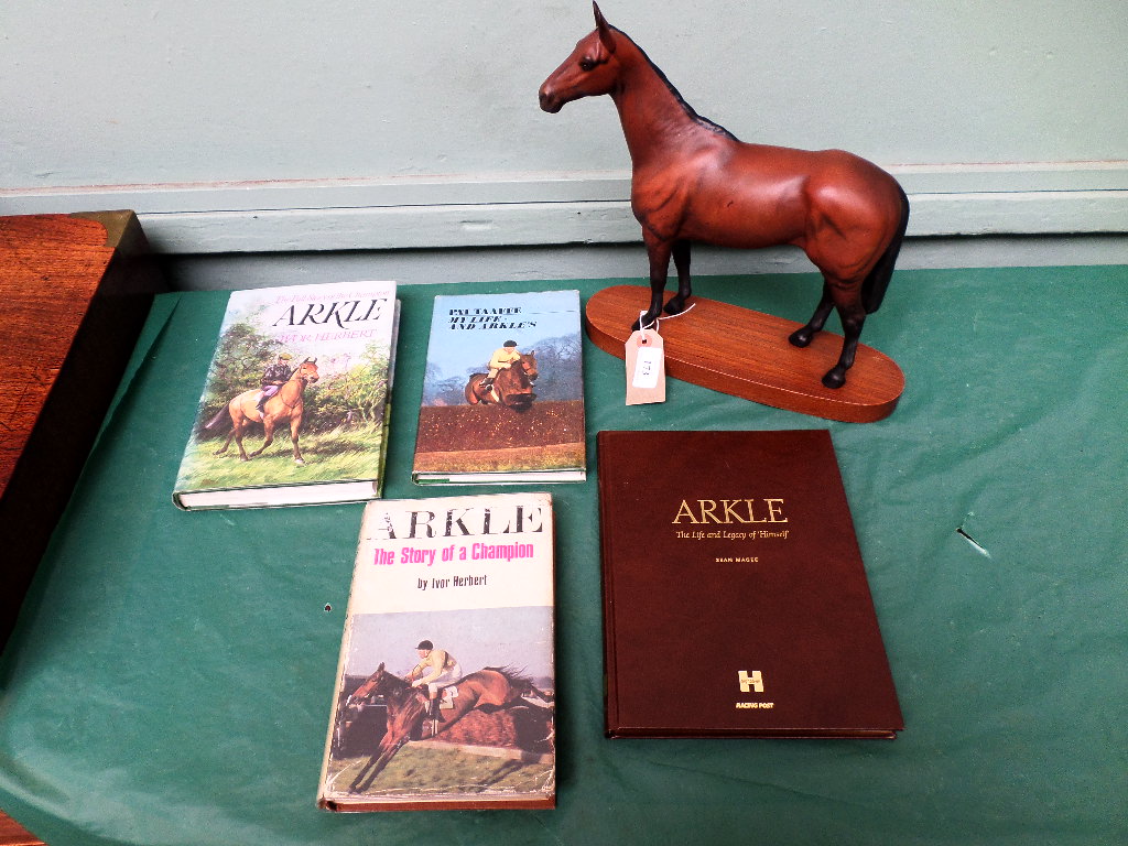 Model of the famous racehore Arkle on oval plinth together with 4 vols.