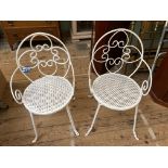 Pair of white painted wrought iron garden seats