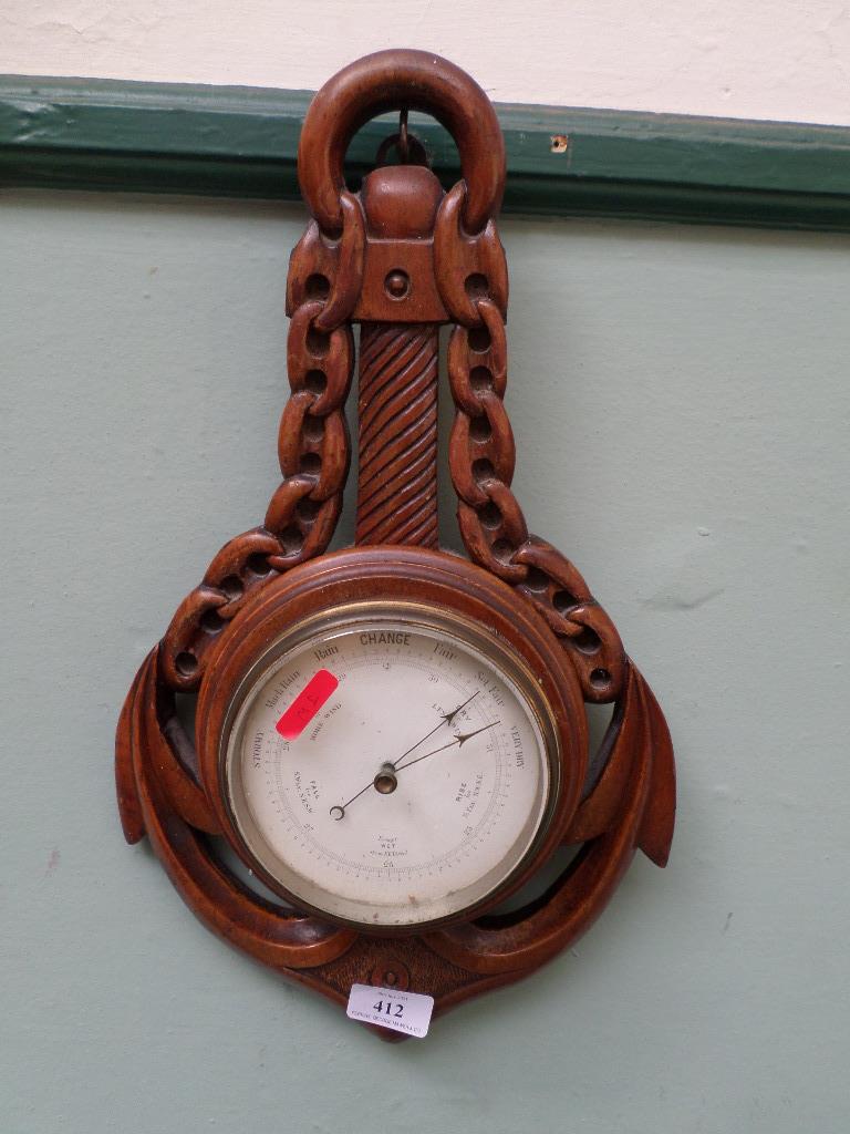 Carved oak cased wall aneroid barometer