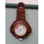 Carved oak cased wall aneroid barometer