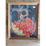Pair of pine framed embroideries of a Spanish Bull Fighter and Lady Dancer