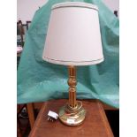 Brass table lamp with beige parchment shade