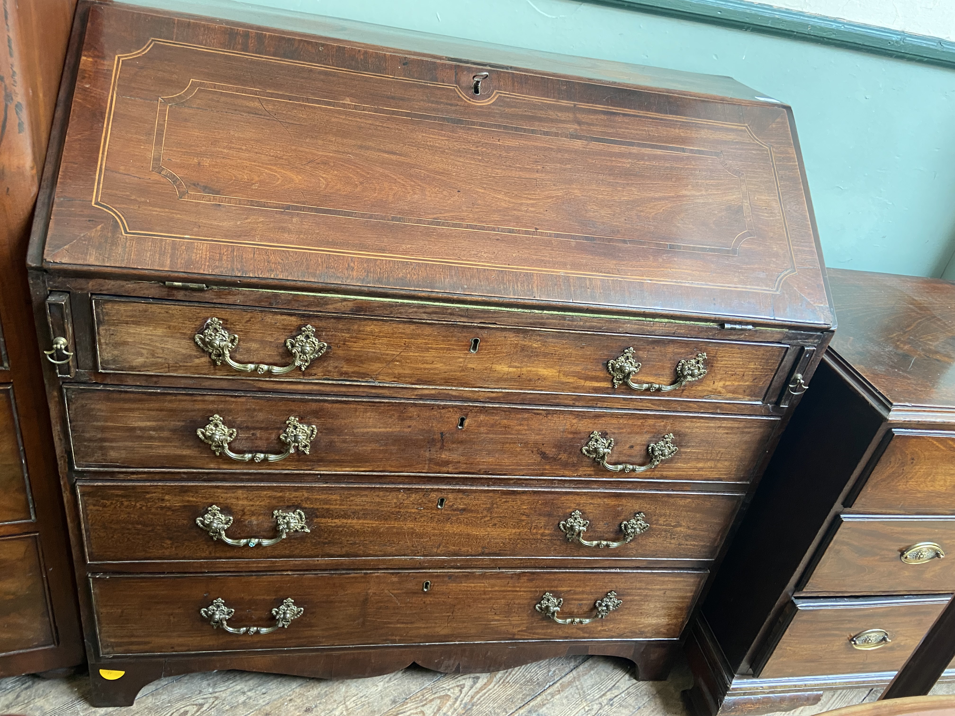 Rich inlaid mahogany fall leaf bureau inset open pigeon holes,