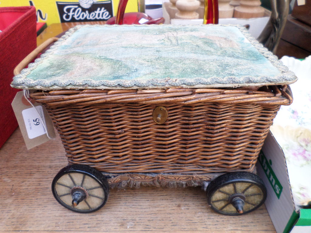 Early wicker needlework box in the shape of a wheeled trolley