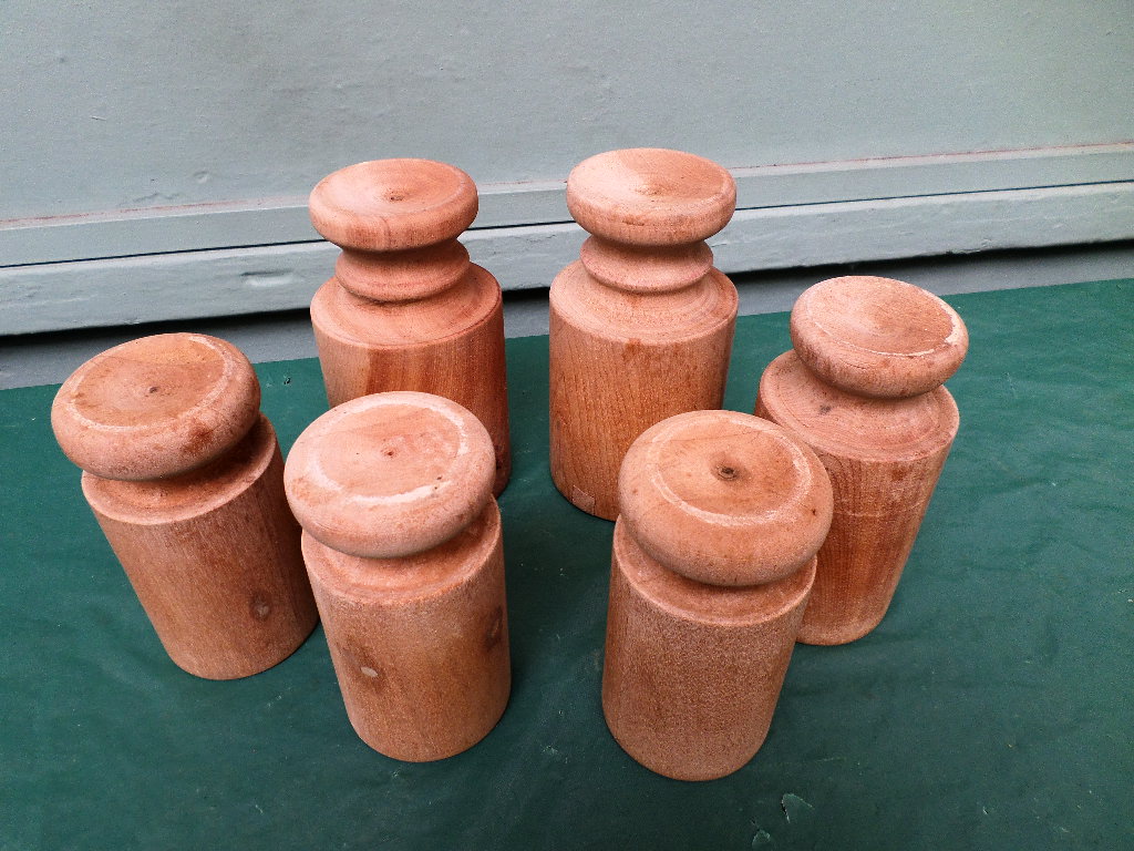 6 mid 20th century wooden pork pie moulds of various sizes