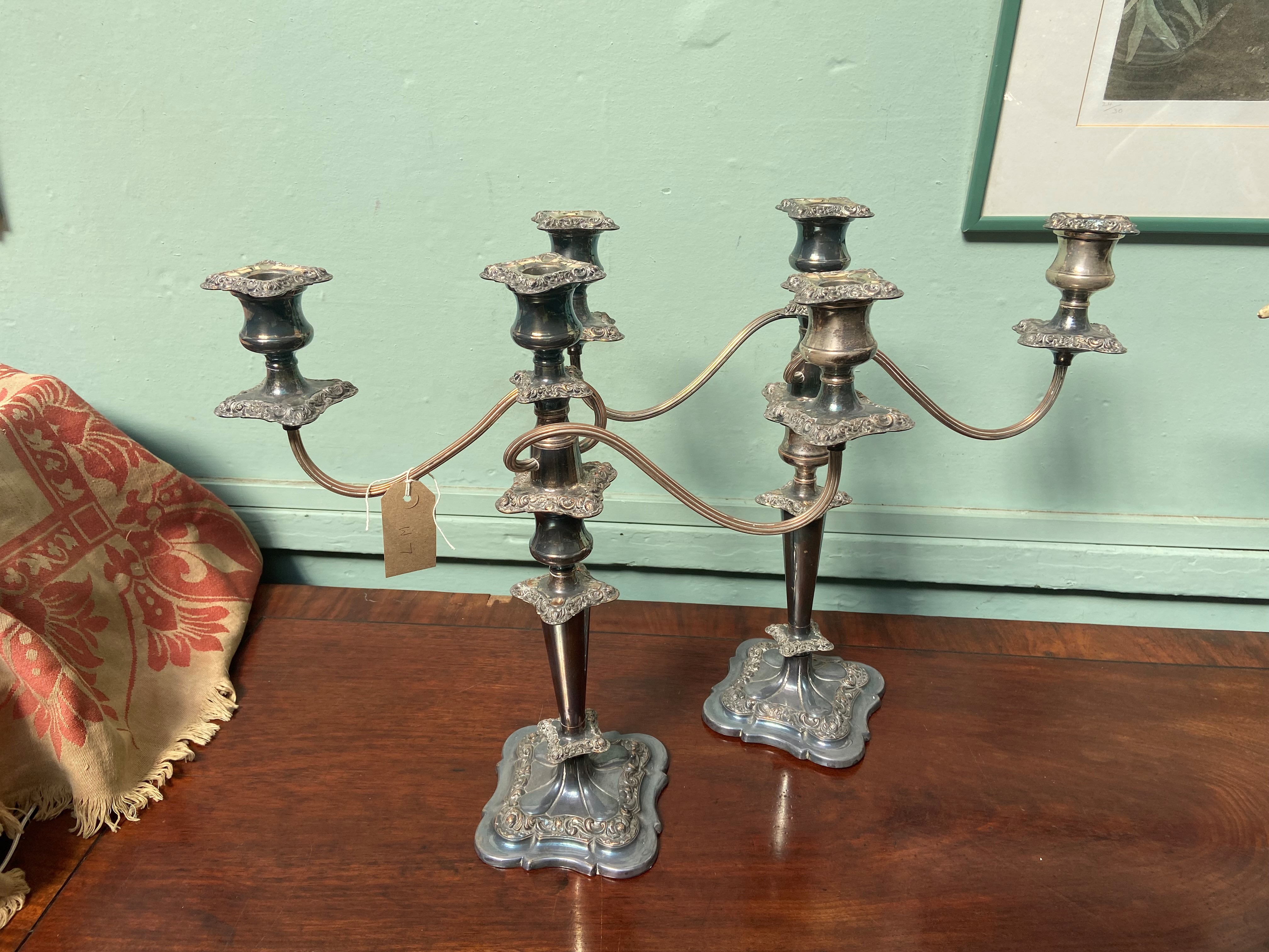Pair of ornate Sheffield silver plated 3 arm/single candlesticks