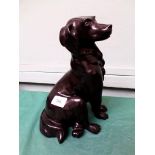 Large figure of a black Labrador