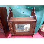 Small mahogany glass door wall cabinet with open upper shelf and single drawer to the interior