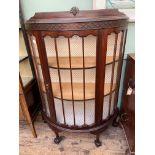 Dark mahogany bow fronted 2 shelf display cabinet on ball and claw feet