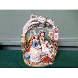Mid 19th Century Staffordshire figure of a garland couple 'The Lovers' holding a spaniel dog