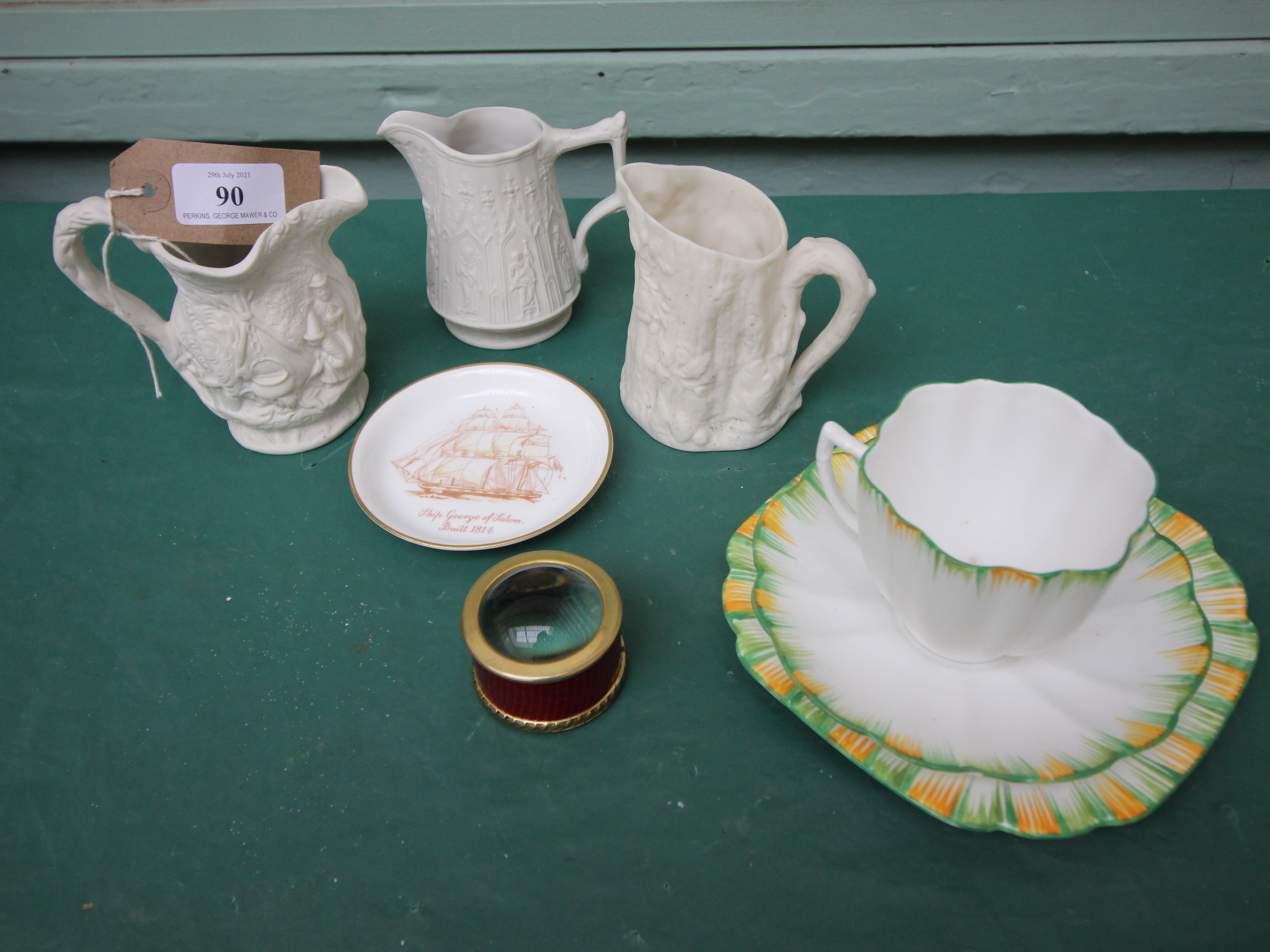 Green and orange surround Melber patterned bone china trio,