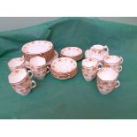 Early 20th Century bone crown china part tea service decorated multi coloured garlands (40 pieces)