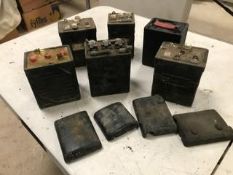 Six old-style batteries, would make ideal battery cases for modern sealed batteries.