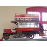 A scale replica model of Beaulieu Motor Museum's open top Edwardian London bus bearing the name of