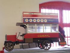 A scale replica model of Beaulieu Motor Museum's open top Edwardian London bus bearing the name of