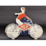A Miller 'Dynamo Lighting' die-cut pictorial tin advertising sign in the form of a man riding a