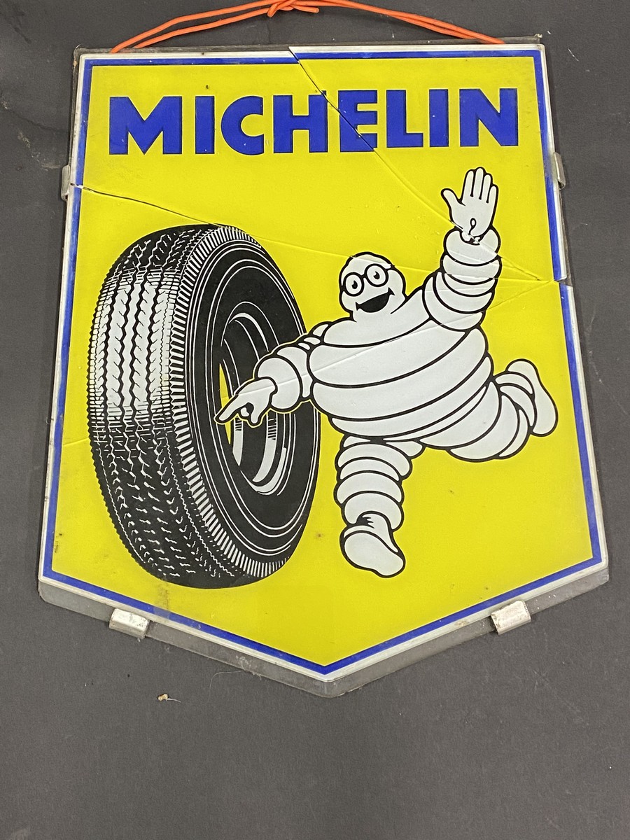 A Michelin pictorial glass sign, damaged, 11 x 13 1/2".