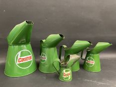 Four graduated contemporary Castrol oil measures and an earlier Castrol gill measure.