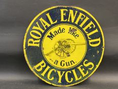 A Royal Enfield Bicycles 'Made like a gun' circular double sided enamel sign by Wildman & Meguyer,