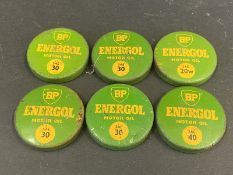 Six BP Energol oil bottle caps.