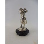 A good quality car accessory mascot in the form of a lady golfer, mounted on a radiator cap.