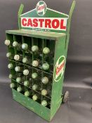 A Wakefield Castrol garage forecourt 25 division oil bottle trolly, with 25 correct pint oil bottles