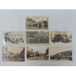 Seven early black and white postcards mostly depicting garage scenes including Arcadia Garages,